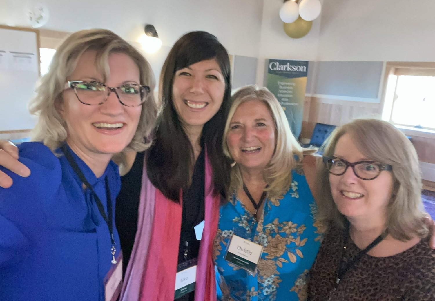 A&iuml;ko with program leads at Clarkson University