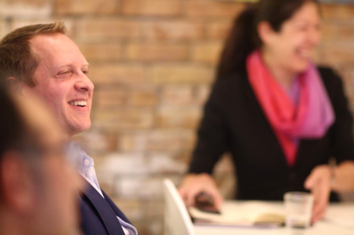 Founders laughing during a mastermind session