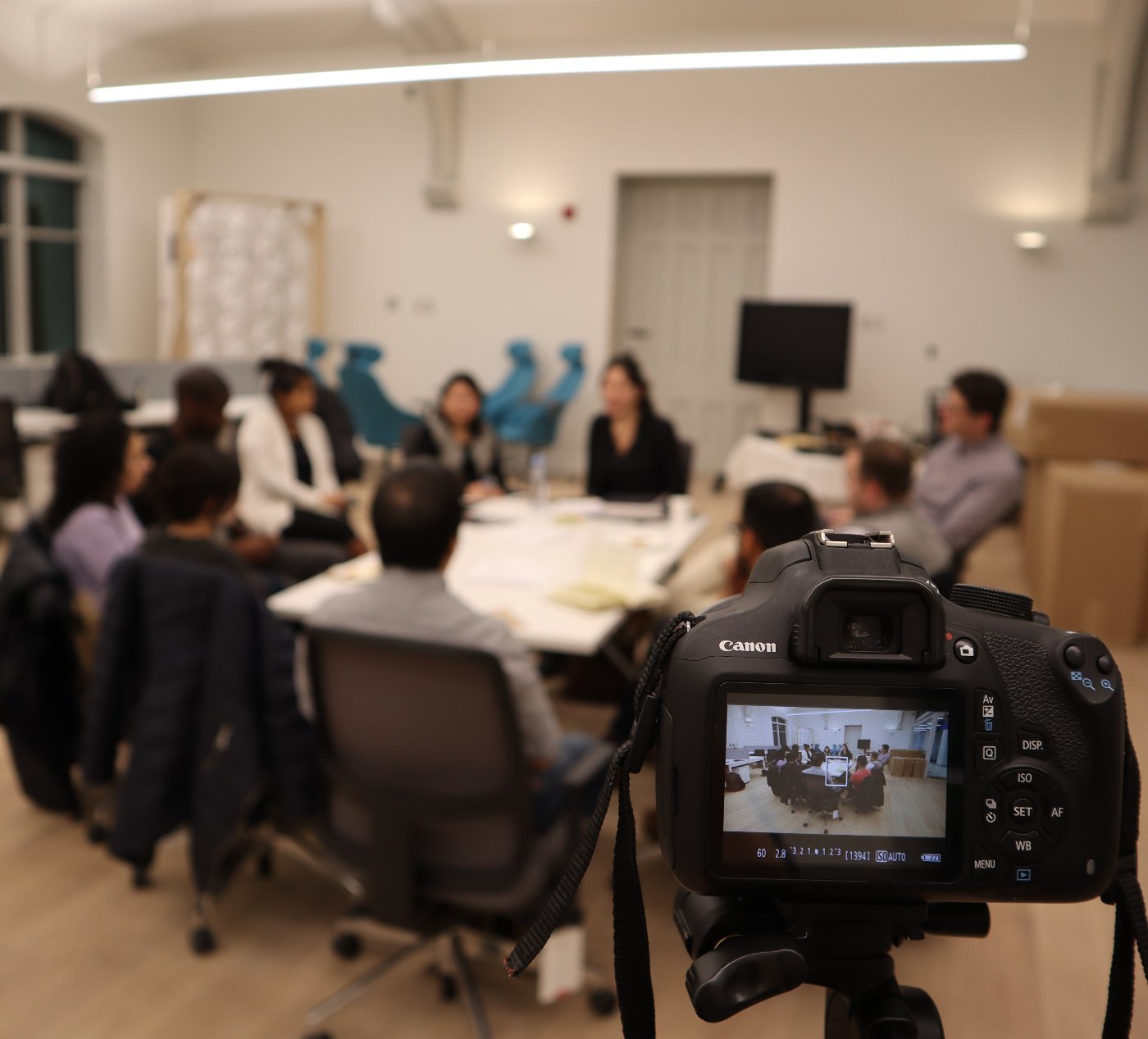 An InFounders mastermind session in progress, filmed from the back of the room