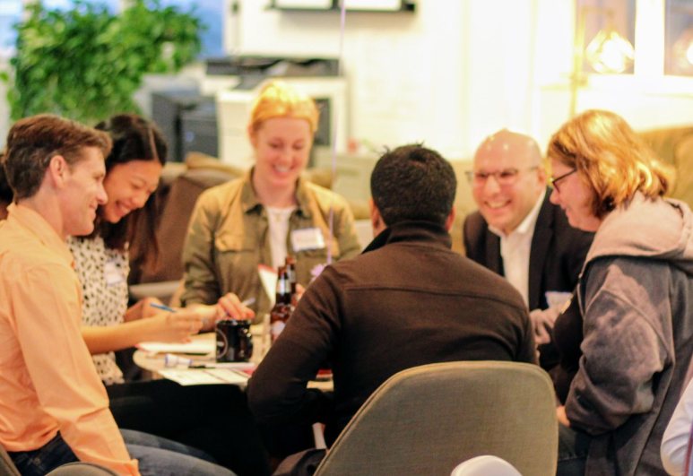 A mastermind group around a table