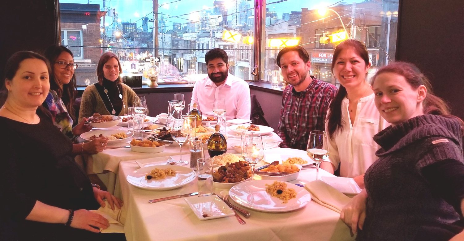 A mastermind group together at dinner